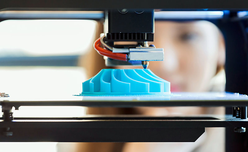 Close up of a 3D printer, printing.