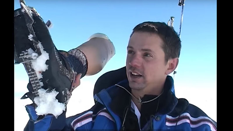 French Paralympic champion Jean-Yves Le Meur holding his prosthetic leg.