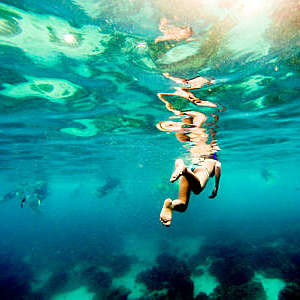 Woman snorkeling in Raya Island,-Thailand.