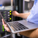 Engineer in the server room close-up. Photo taken at a Data Center in Bulgaria, Eastern Europe.