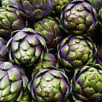 full frame of purple italian artichokes at the farmer's market