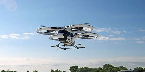 Low-angle view of the new Airbus taxi drone against a blue sky