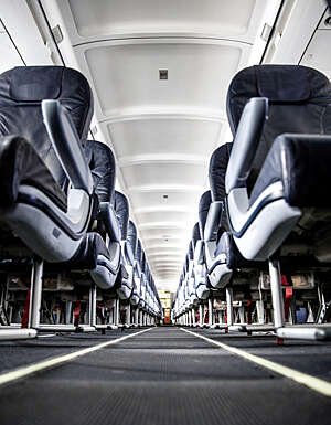 View up the aisle of an empty aircraft carrier.