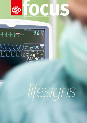 Cardiogram monitor in surgery while not recognizable doctor operates. The focus is on the screen